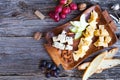 Wine snack set. Glass of red and white wine, grape and various s