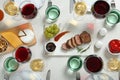 Wine and snacks served for dinner on light table Royalty Free Stock Photo