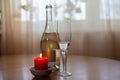 Wine sparkling white, glass and a candle on the table Royalty Free Stock Photo