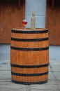 Wine standing on a wooden barrel Royalty Free Stock Photo