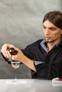 Wine steward fills glass. Royalty Free Stock Photo