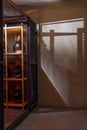 Wine storage cage casting patterned cellar wall shadow Royalty Free Stock Photo