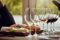 Wine tasting, cheese platter and winery restaurant with alcohol and glass for customer. Waiter, drink and sommelier with Royalty Free Stock Photo