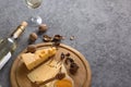 Wine tasting concept with traditional appetizers of cheese, nuts and honey