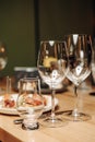 Wine tasting experience in the rustic cellar and wine bar: red wine glass and collection of excellent wines on the