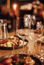 Wine tasting experience in the rustic cellar and wine bar: red wine glass and collection of excellent wines on the