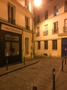 Wine Tasting in Paris storefront at the bend in a Paris street at night