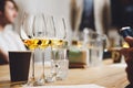 Wine tasting preparation. Various white wines in glasses without name. Blind degustation. Royalty Free Stock Photo