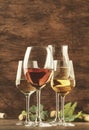 Wine tasting. Red, white, rose and champagne - still and sparkling wines sin glasses on vintage wooden table background Royalty Free Stock Photo