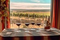 wine tasting setup with empty glasses and vineyard view Royalty Free Stock Photo