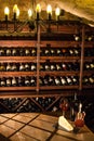 Wine vault. Nice composition of wine glass, cheese and accessories on a wooden table.