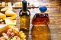 Wine and Whiskey on Table with Cheese and Grapes Royalty Free Stock Photo