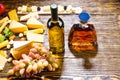 Wine and Whiskey on Table with Cheese and Grapes