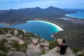 Meditation on Mount Amos Summit Overlooking Wineglass Bay in Freycinet National Park, East Tasmania, Australia