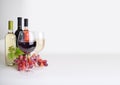 Wineglass, bottles of wine and grapes Royalty Free Stock Photo