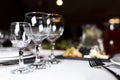 Wineglass and other cutlery on the festive table of restaraunt