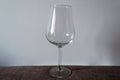 Simple wineglass on a textile table Royalty Free Stock Photo