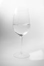 Wineglass with water on white background. Elegance luxury drink