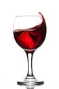 Wineglass with wine red juice beverage splashing wave and ice cube isolated on white background full size Royalty Free Stock Photo