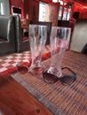 Wineglasses , table , two spectacles , brown