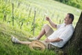 Winemaker drinks white wine Royalty Free Stock Photo