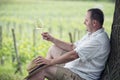 Winemaker drinks white wine Royalty Free Stock Photo