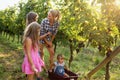 Winemaker family together in vineyard