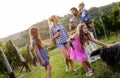 Winemaker family together in vineyard