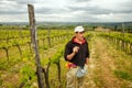 Winemaker standing in his vineyard near Montalcino
