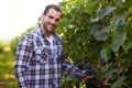 Winemaker in vineyard