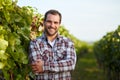 Winemaker in vineyard