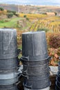 Winemaking in oldest wine region in world Douro valley in Portugal, plastic buckets for harvesting of wine grapes, production of