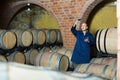 Winery employee with glass of wine Royalty Free Stock Photo