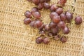 Winery grapes on rattan background