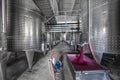 Winery producing wine, Grape ju in tank. Wine fermentation tanks. Wine fermentation process Red grapes in fermentation tank. Royalty Free Stock Photo