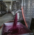 Winery producing wine, Grape ju in tank. Wine fermentation tanks. Wine fermentation process Red grapes in fermentation tank. Royalty Free Stock Photo