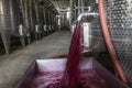 Winery producing wine, Grape ju in tank. Wine fermentation tanks. Wine fermentation process Red grapes in fermentation tank. Royalty Free Stock Photo