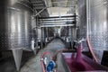 Winery producing wine, Grape ju in tank. Wine fermentation tanks. Wine fermentation process Red grapes in fermentation tank. Royalty Free Stock Photo