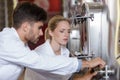 winery workers in fermenting factory Royalty Free Stock Photo