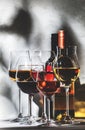 Wines assortment. Red, white, rose wine in wineglasses on gray background. Wine tasting concept. Hard sunlight and shadows from Royalty Free Stock Photo