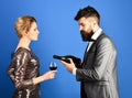 Winetasting and celebrating concept. Man with beard, woman in dress
