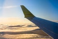 Wing of AirBaltic plane flying in the sky