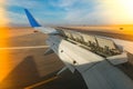 The wing of an aircraft with open flaps on the wing that is landing. The wing of a passenger aircraft with air brakes Royalty Free Stock Photo