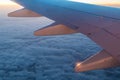 Wing of airplane above clouds Royalty Free Stock Photo