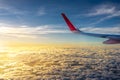 The wing of airplane in front of sunset Royalty Free Stock Photo