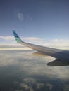 Wing of airplane garuda indonesia Royalty Free Stock Photo