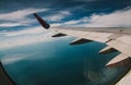 Wing of an airplane over the gulf of Thailand