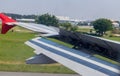 Wing braking of the aircraft on the runway. The wing of an aircraft open flaps on the wing for is landing.