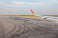 Wing while breaking during landing on runway . Royalty Free Stock Photo
