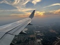 The wing of a commercial airline airplane while flying high in the sky over Dallas Texas on a trael vacation Royalty Free Stock Photo